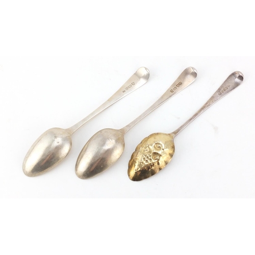 955 - Two Georgian silver tablespoons and a berry spoon, various London hallmarks, the largest 21cm in len... 