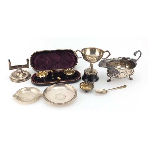 945 - Silver items including a three footed sauce boat, Chinese coin dish, pair of salts in a fitted case ... 