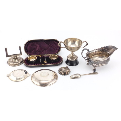 945 - Silver items including a three footed sauce boat, Chinese coin dish, pair of salts in a fitted case ... 