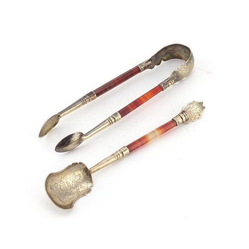 948 - Pair of Scottish agate sugar nips and matching spoon, both with silver plated mounts, the sugar nips... 