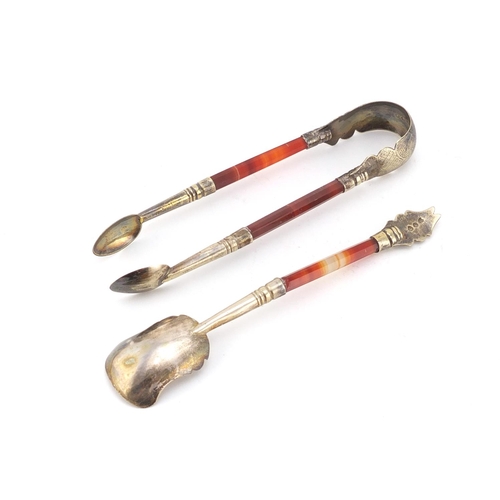 948 - Pair of Scottish agate sugar nips and matching spoon, both with silver plated mounts, the sugar nips... 