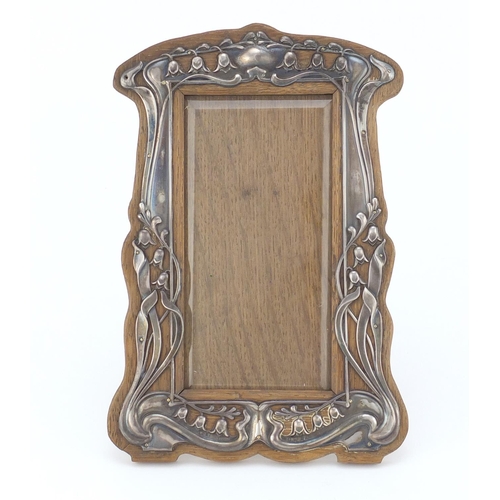 857 - Art Nouveau silver and oak easel photo frame with bevelled glass, by William Hair Haseler, Birmingha... 