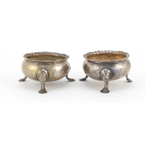 951 - Pair of Edwardian silver open salts, raised on three hoof feet, indistinct makers mark Chester 1910,... 