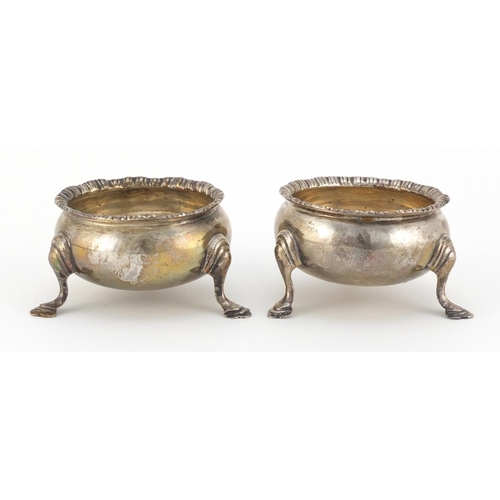 951 - Pair of Edwardian silver open salts, raised on three hoof feet, indistinct makers mark Chester 1910,... 