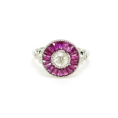1008 - Platinum ruby and diamond halo ring, size N, 4.9g