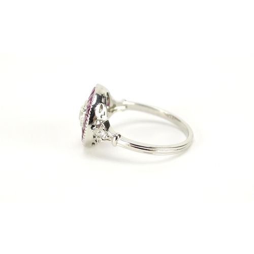 1008 - Platinum ruby and diamond halo ring, size N, 4.9g