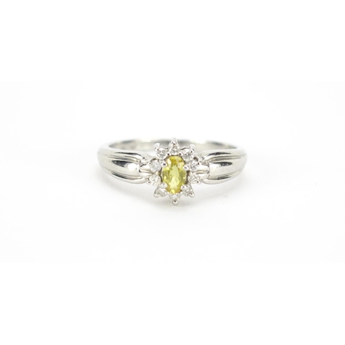 1003 - Platinum, yellow sapphire and diamond ring, size P, 4.9g