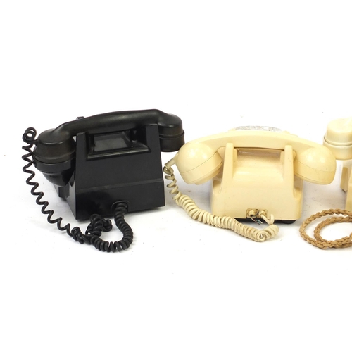 69 - Four vintage Bakelite dial telephones including a cream GPO example with base drawer