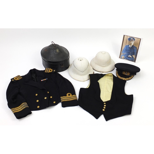 295 - British Military World War II Royal Naval uniform including two pith helmets, Gieves peaked cap, tun... 