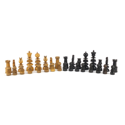 377 - 19th century box wood and ebony carved chess set, housed in a pine case, the largest piece 10cm high