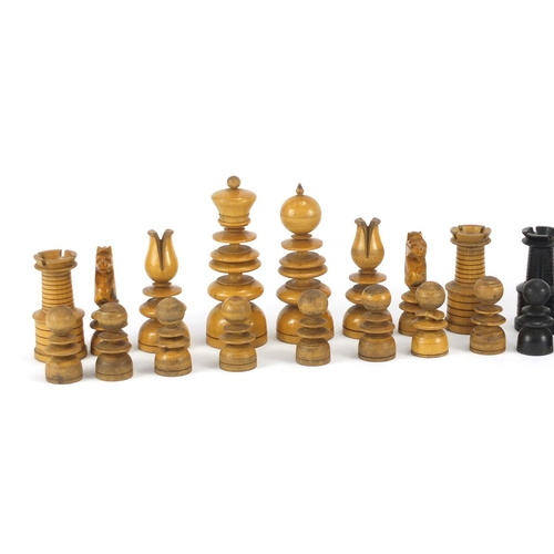 377 - 19th century box wood and ebony carved chess set, housed in a pine case, the largest piece 10cm high
