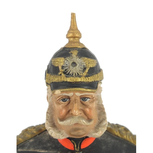 300 - German hand painted terracotta bust of a soldier in Military dress by Deponirt, 11.5cm high