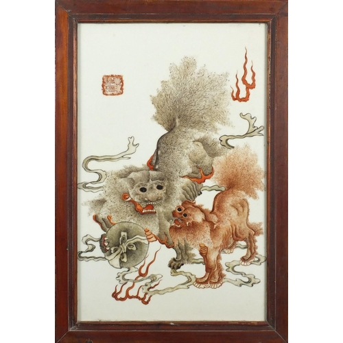 389 - Chinese porcelain panel housed in hardwood frame, finely hand painted with two Shishi with a ball, s... 