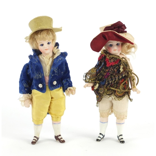 365 - Pair of early 19th century bisque dolls house dolls with jointed limbs, probably French, each 15.5cm... 