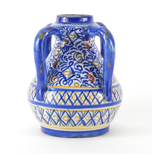 720 - Islamic Hand painted pottery vase with four handles, 17.5cm high