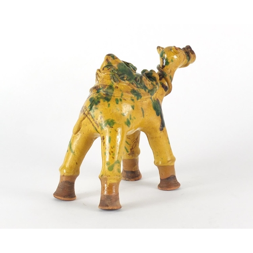 717 - Turkish Canakkale pottery camel ewer, having a yellow and green glaze, 16cm high