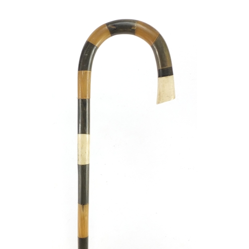 140 - Segmented horn and bone walking stick, possibly rhinoceros horn, 98cm in length