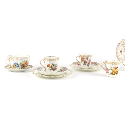 789 - Dresden porcelain hand painted with flowers, comprising a basket shaped fruit bowl, three coffee cup... 