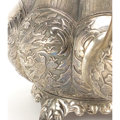 592 - Good Chinese Canton silver teapot by Khecheong, finely embossed with birds amongst a landscape, 19cm... 