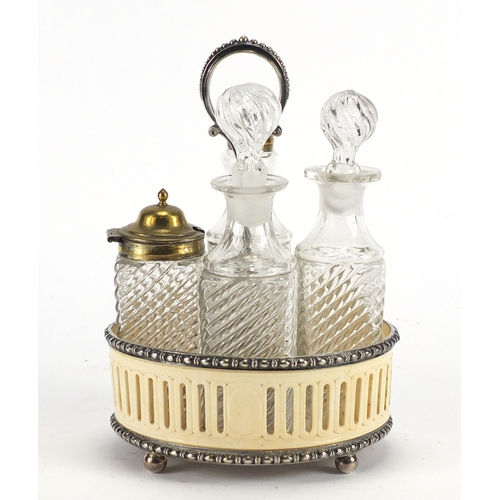 73 - Early Victorian pierced ivory and silver plated cruet set with four glass bottles, 21.5cm high