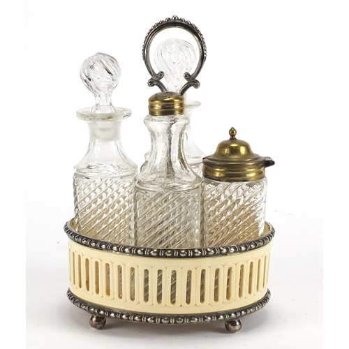 73 - Early Victorian pierced ivory and silver plated cruet set with four glass bottles, 21.5cm high
