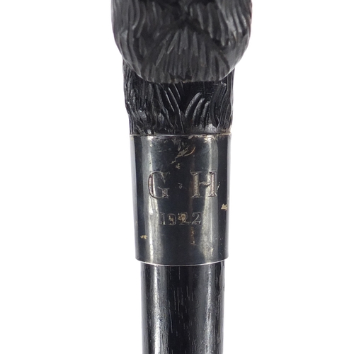 159 - Black forest ebonised walking stick with carved Scotty dog head design handle, 92cm in length