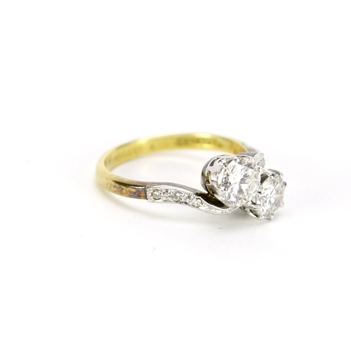 959 - 18ct gold and platinum diamond crossover ring, approximately 1.0ct in total, size M, 3.9g