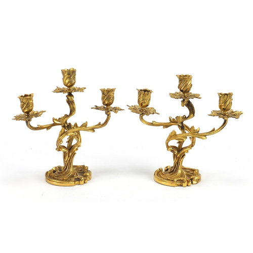 15 - Pair of 19th century French Louis XV ormolu three branch candelabras, each 25cm high