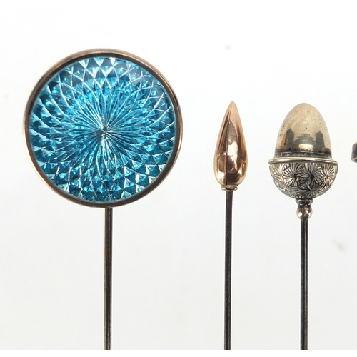 105 - Six vintage hat pins including a 9ct gold example and three with enamel, the largest  26cm in length