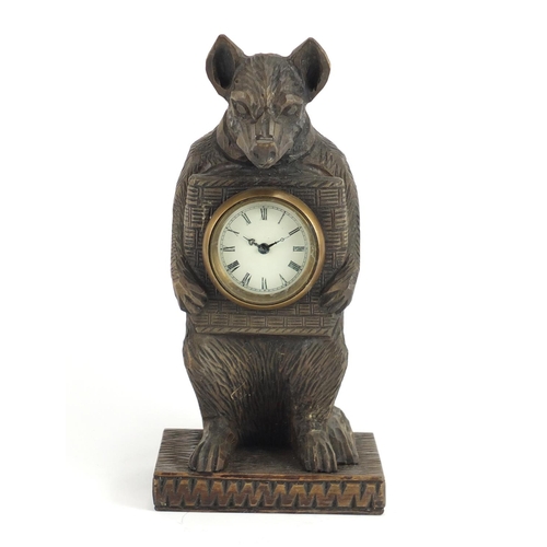2449 - Black forest style carved wood bear design  clock, with enamelled dial and Roman numerals, 30.5cm hi... 