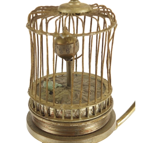 2186 - Clockwork automaton musical bird cage clock, raised on a hanging chrome and marble stand, 29cm high