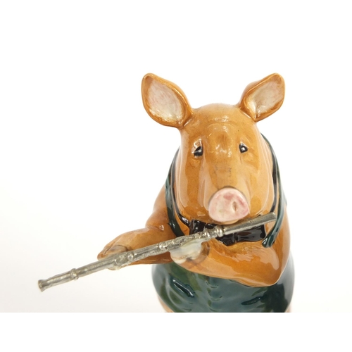 2492 - Two Beswick pig band figures and a Beatrix Potter figure, the largest 13cm high