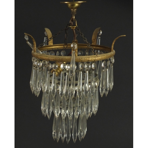2133 - Circular brass four tier chandelier with cut glass drops, 35cm high x 22cm in diameter