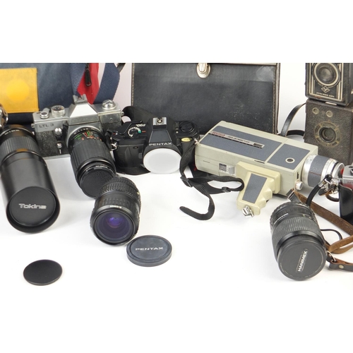 632 - Vintage and later cameras, lenses and accessories including Praktica, Pentax, Tokina and Canon