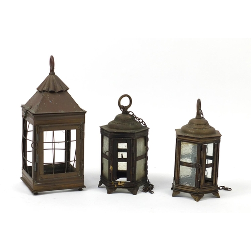 679 - Three vintage copper and brass lanterns, the largest 43cm high