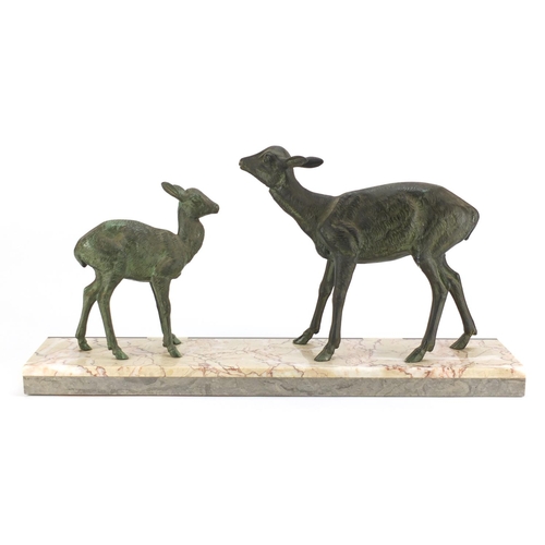 2127 - Art Deco bronzed sculpture of two deer raised on a marble base, 55.5cm wide