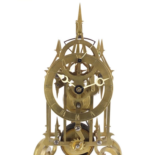 2180 - Gothic style brass skeleton clock with fusee movement, housed under a glass dome, overall 39cm high