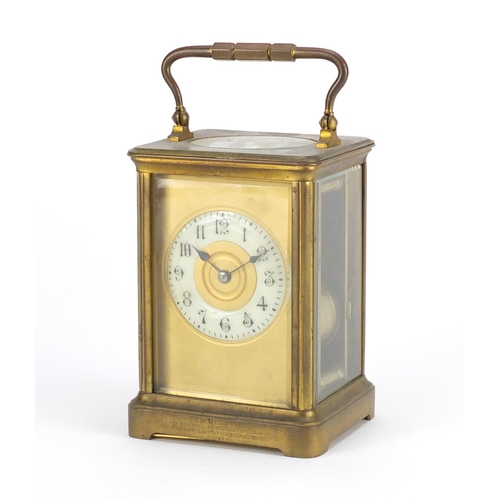 2351 - Large French brass cased carriage clock with enamelled chapter ring, Arabic numerals and leather tra... 