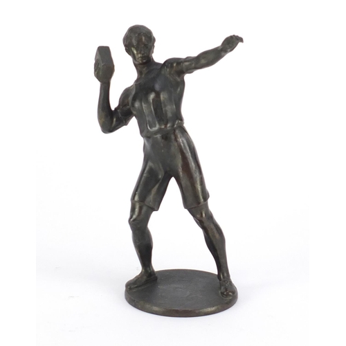 2245 - Patinated bronze figure of a young boy throwing a brick , 18cm high