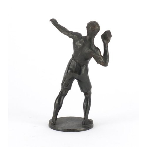 2245 - Patinated bronze figure of a young boy throwing a brick , 18cm high