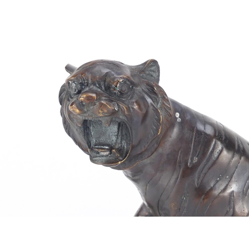 2291 - Large Japanese patinated bronze tiger, 32cm in length