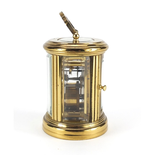 2243 - Miniature brass cased oval carriage clock, the dial having Roman numerals, impressed LD to the back ... 