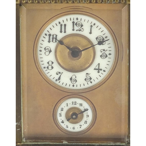 2299 - Miniature brass cased carriage alarm clock with subsidiary dial and enamelled chapter rings, both ha... 