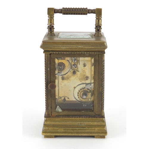 2299 - Miniature brass cased carriage alarm clock with subsidiary dial and enamelled chapter rings, both ha... 