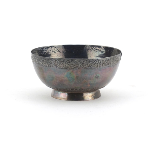 2656 - Circular unmarked silver footed bowl, engraved with fruiting vines, 10.5cm in diameter, 121.7g
