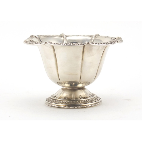 2653 - American sterling silver footed bowl, embossed with stylised motifs, 8cm high, 113.5g