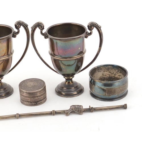2652 - Silver items including a pair of miniature twin handled trophies, pair of napkin rings and an opium ... 