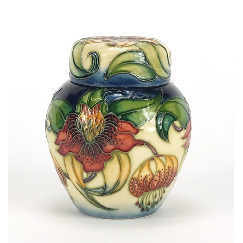 2428 - Moorcroft pottery ginger jar and cover with box, hand painted in the Anna Lily pattern, 11cm high