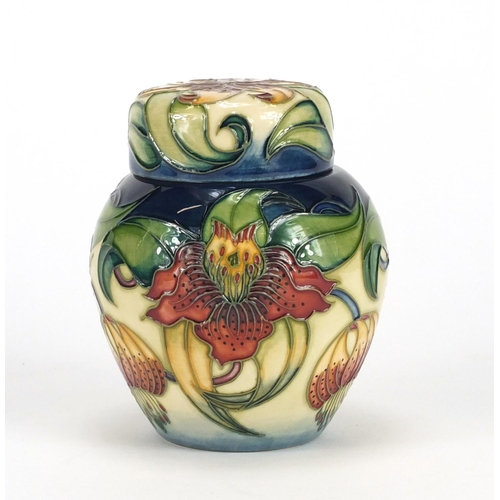 2428 - Moorcroft pottery ginger jar and cover with box, hand painted in the Anna Lily pattern, 11cm high