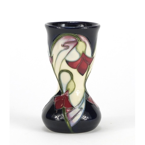 2184 - Moorcroft pottery vase with box, hand painted with stylised flowers, dated 2006, 11cm high
